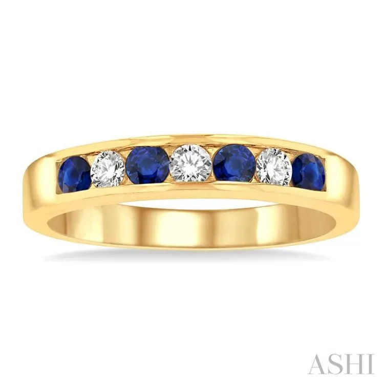 1/5 Ctw Channel Set Round Cut Diamond and 2.5 MM Round Cut Sapphire Band in 14K Yellow Gold