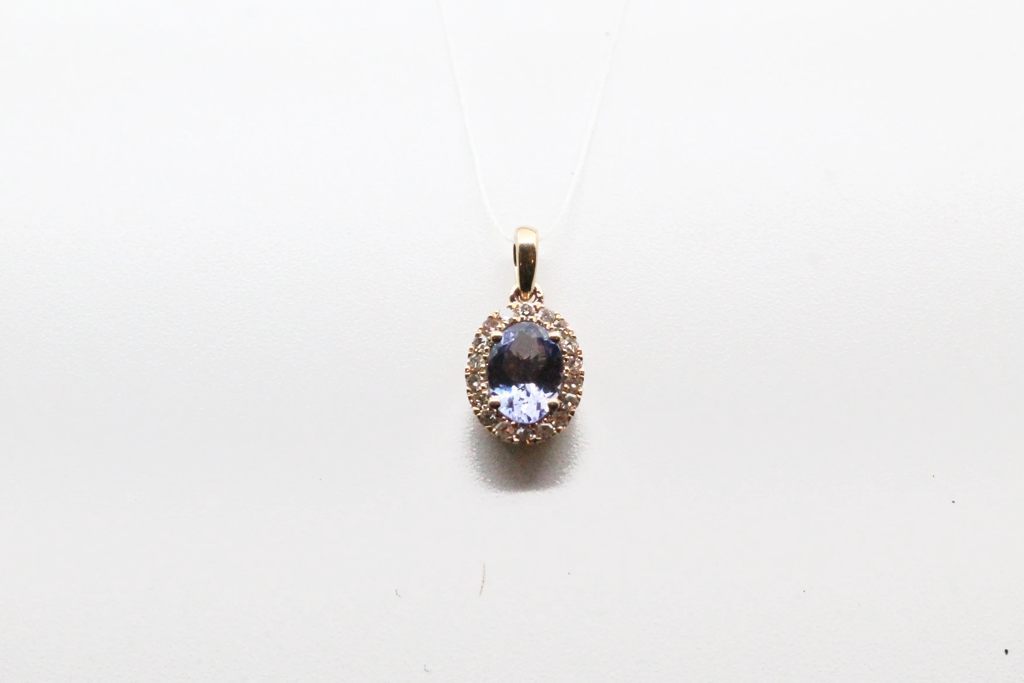 Yellow Gold Tanzanite with Diamond Halo Pendant